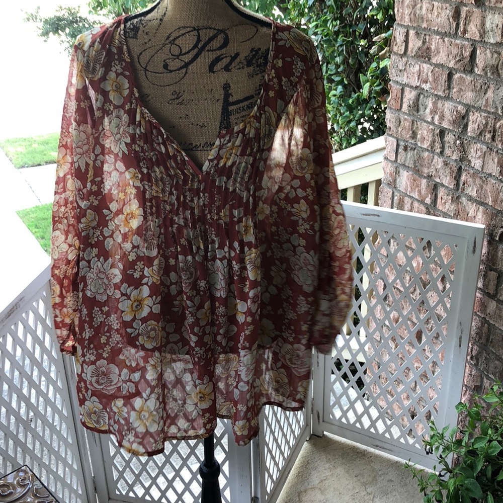 Brown and beige floral print sheer blouse.